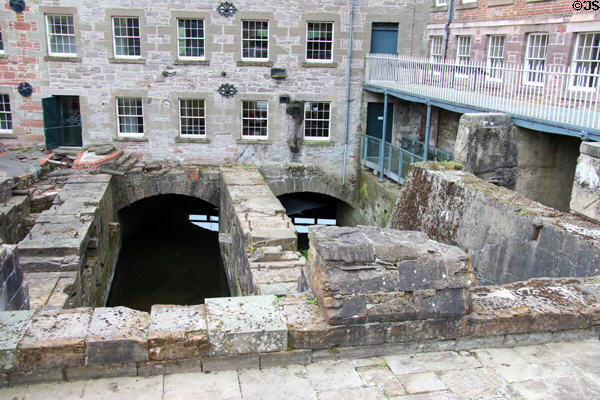 Mill race with walls to support waterwheels at Stanley Mills. Stanley, Scotland.