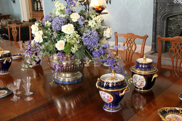 Flower display in silver Monteith with Worcester Chamberlain porcelain (18thC) ice cream pails in dining room at Scone Palace. Perth, Scotland.
