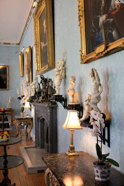 Dining room collection of ivory statuettes (17th-18thC) along wall at Scone Palace. Perth, Scotland.