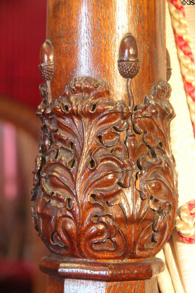 Carved oak leaves & acorns on bedpost of canopy bed (1842) made for queen's visit in Queen Victoria suite at Scone Palace. Perth, Scotland.