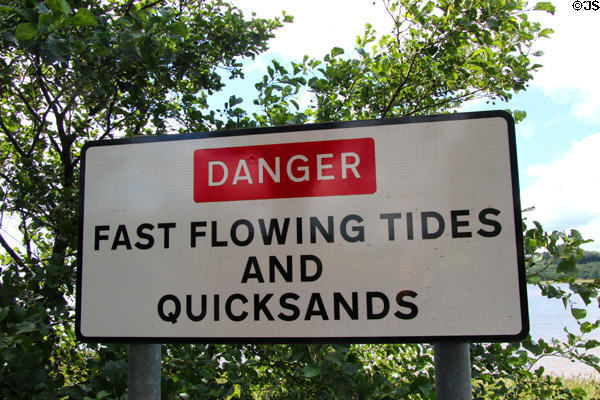 Danger Fast Flowing Tides and Quicksands sign at River Nith. Caerlaverock, Scotland.