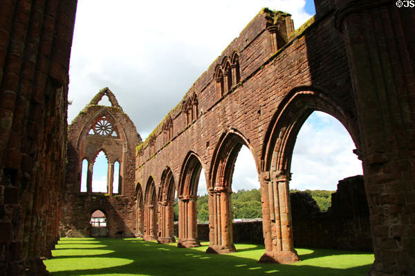 Gothic nave arches ruins at Sweetheart Abbey. New Abbey, Scotland.