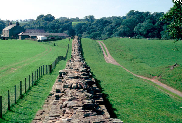 Hadrian's Wall, built (122 CE) by Romans to secure northern boundary of Britannia, runs with a walking path from Irish to North Sea entirely within England. Scotland.