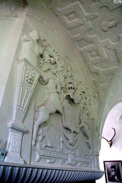 Sculpted plaster royal arms over fireplace at Craigievar Castle. Alford, Scotland.