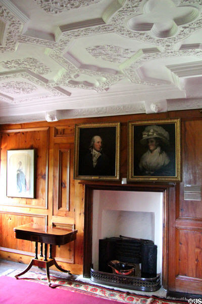Sculpted plaster ceiling over fireplace with portraits in Queen's room at Craigievar Castle. Alford, Scotland.