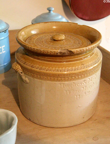 Stoneware storage jar similar to Scottish Portobello pottery marked Hughes & McN Wine Merchants, Haddington at Crathes Castle. Crathes, Scotland.