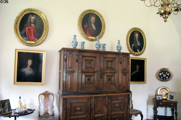 Cabinet & portraits in High Hall at Crathes Castle. Crathes, Scotland.