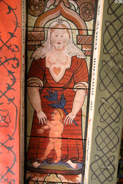 Charity as bare breasted matron holding child ceiling painting in Muses room at Crathes Castle. Crathes, Scotland.