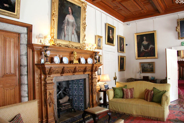 Drawing room with carved oak fireplace at Drum Castle. Drumoak, Scotland.