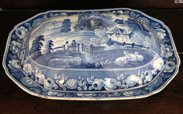 Blue serving dish with cover decorated with rural thatch cottage at Drum Castle. Drumoak, Scotland.