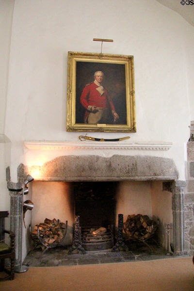 The Hall fireplace with portrait of Gen. Alexander Mackenzie Fraser (1758-1809) at Castle Fraser. Aberdeenshire, Scotland.