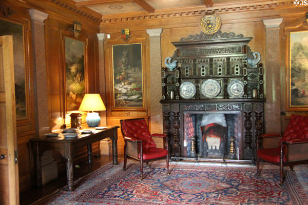 Ground floor entrance hall with fireplace & Aesop's fables paintings in paneling at Haddo House. Methlick, Scotland.