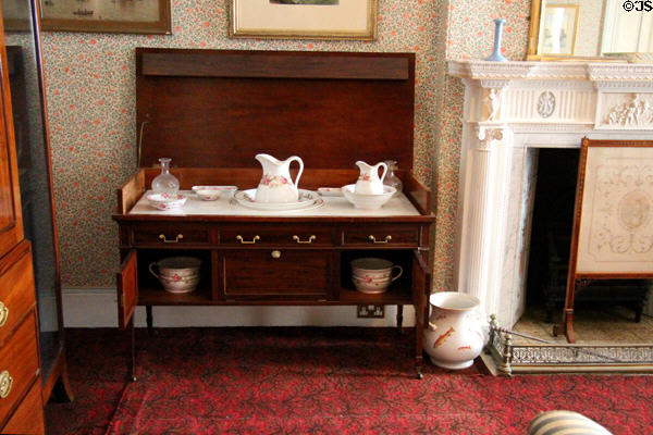 Bedroom washstand with hinged cover with complete basin & pitcher sets plus two lower doors to hide chamber pots at Haddo House. Methlick, Scotland.