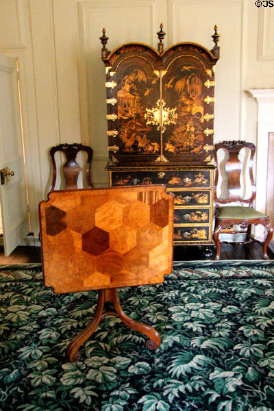 Tilt-top table & Chinese cabinet in bedroom at Brodie Castle. Brodie, Scotland.