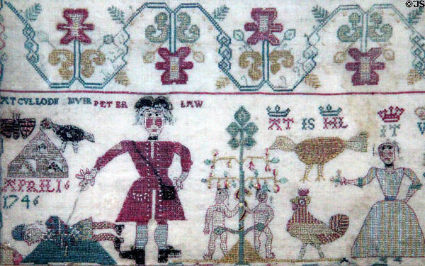 Sampler detail (1746) by young girl shows English red coat slaying a kilted Jacobite at Culloden (April 16, 1746) at Culloden Moor Visitor Centre. Culloden Moor, Scotland.