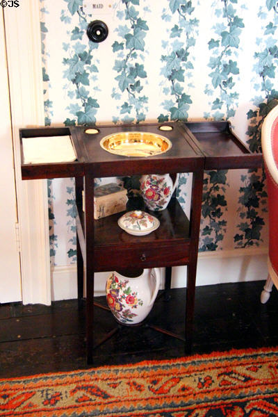 Washstand with hinged covers over basin & pitcher beneath in Woodcock bedroom at Cawdor Castle. Cawdor, Scotland.