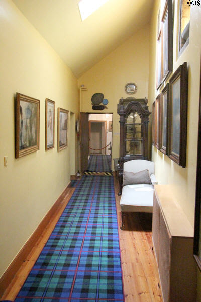 Collection of Scottish paintings in Tartan Passage at Cawdor Castle. Cawdor, Scotland.