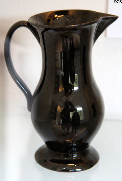 Black glazed earthenware jug with loop handle (c1750-1790) at Coalport China Museum. Ironbridge, England.