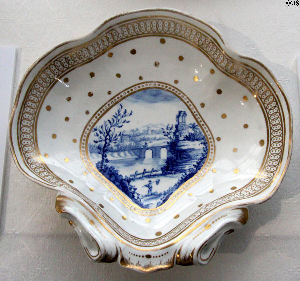 Caughley Porcelain (aka Salopian) shell shaped dessert dish painted with cobalt blue country scene & gold trim (c1786-93) at Coalport China Museum. Ironbridge, England.