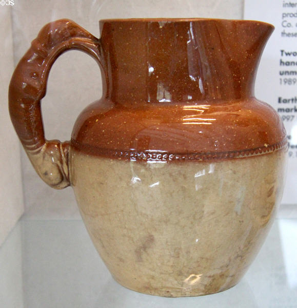 Earthenware jug with handle in form of dog (c1880-1910) prob. Benthall Pottery at Coalport China Museum. Ironbridge, England.