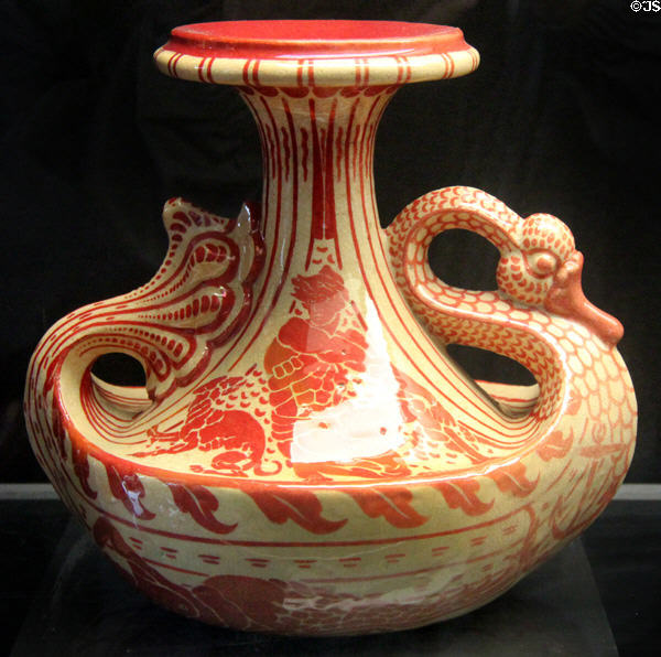 Swan art pottery vase painted lustre red (1889-91) by Walter Crane for Maw & Co at Jackfield Tile Museum. Ironbridge, England.