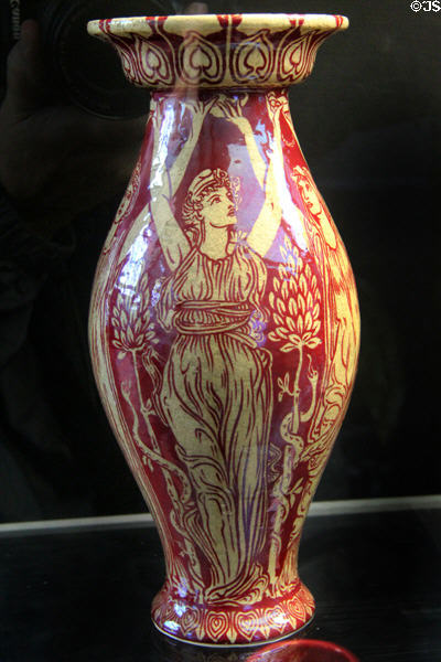 Classical female figures holding oil lamps art pottery vase painted lustre red (c1890s) by Walter Crane for Maw & Co at Jackfield Tile Museum. Ironbridge, England.