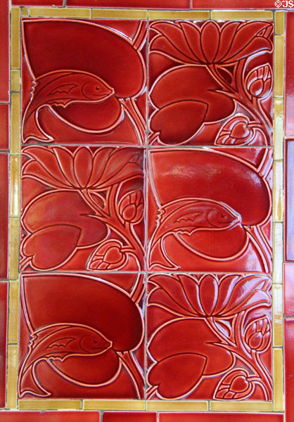 Fish & flowers relief-moulded tile panel by C.F.A. Voysey for Pilkington tiles at Jackfield Tile Museum. Ironbridge, England.