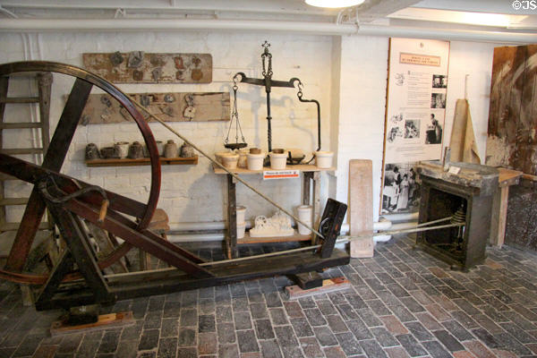 Rope & pulley wheel (c1700s on) used to turn pottery wheels for forming clay at Gladstone Pottery Museum. Longton, Stoke, England.