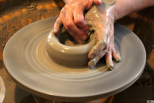 Forming wares on pottery wheel at Gladstone Pottery Museum. Longton, Stoke, England.