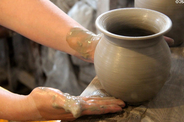 Forming wares on pottery wheel at Gladstone Pottery Museum. Longton, Stoke, England.