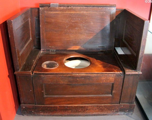 Replica of Thomas Crapper & Co flush water closet (Victorian era) in bathroom history gallery at Gladstone Pottery Museum. Longton, Stoke, England.