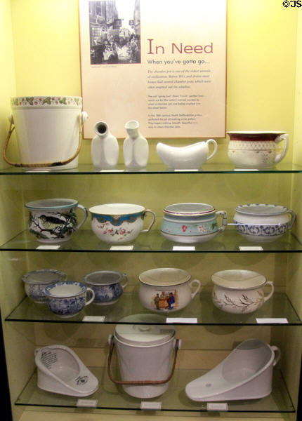 Collection of chamber pots (18thC on) by several Staffordshire potteries in bathroom history display at Gladstone Pottery Museum. Longton, Stoke, England.