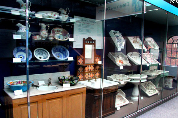 Collection of ceramic sink (18thC on) by several Staffordshire potteries in bathroom history display at Gladstone Pottery Museum. Longton, Stoke, England.