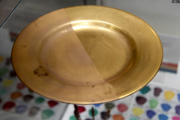 Demonstration of gilding stages for hand burnishing gold applied to china plate at Gladstone Pottery Museum. Longton, Stoke, England.