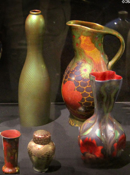 Earthenware vases in iridescent green or lustred colors (c1900) by Zsolnay Factory of Pecs, Hungary at Potteries Museum & Art Gallery. Hanley, Stoke-on-Trent, England.