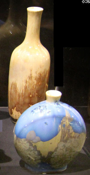 Porcelain vases with brown crystalline glazes on buff or blue ground (c1900) by Royal Porcelain Factory of Copenhagen, Denmark at Potteries Museum & Art Gallery. Hanley, Stoke-on-Trent, England.