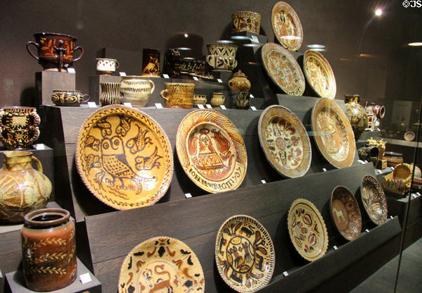 Collection of slip decorated earthenware dishes (1600s) made in North Straffordshire at Potteries Museum & Art Gallery. Hanley, Stoke-on-Trent, England.