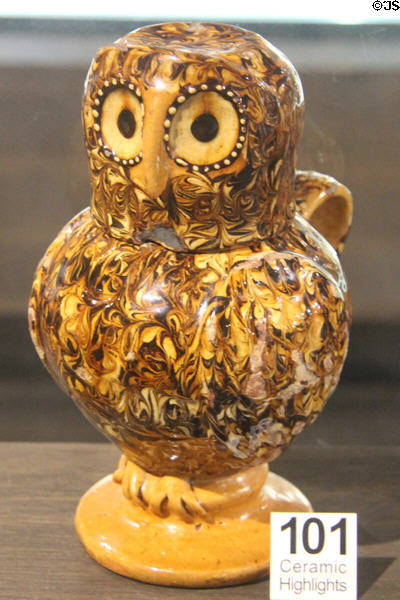 Slipware owl jug where body is jug & head is cup (c1680-1700) made in Straffordshire at Potteries Museum & Art Gallery. Hanley, Stoke-on-Trent, England.