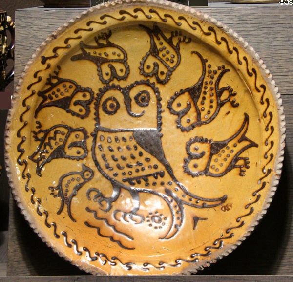 Slip decorated dish with owls (1710-30) made in North Straffordshire at Potteries Museum & Art Gallery. Hanley, Stoke-on-Trent, England.