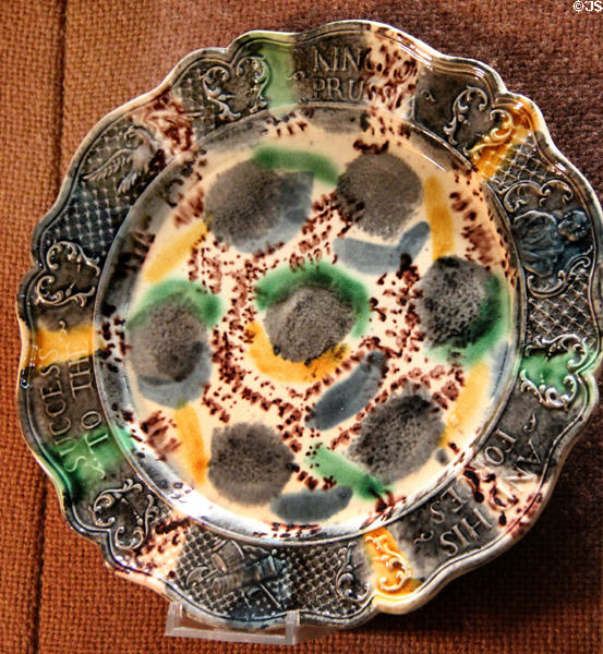 Earthenware plate inscribed 'Success to the King of Prussia and his Forces' stained with manganese oxide under lead glaze (c1750-70) from Straffordshire supporting his fight in Seven Years War at Potteries Museum & Art Gallery. Hanley, Stoke-on-Trent, England.