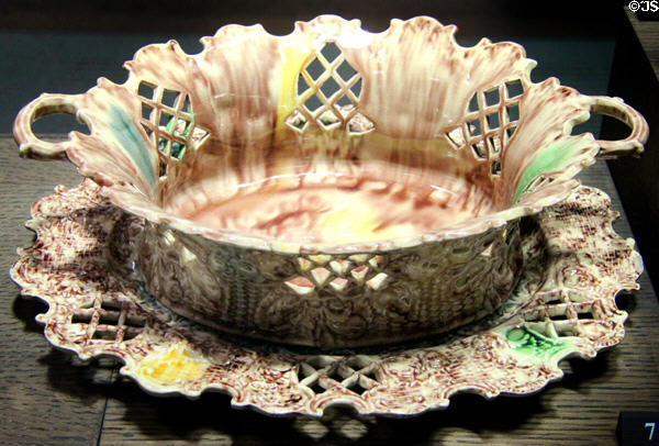 Earthenware basket & stand stained with colored oxides under lead glaze (c1750-70) probably by Thomas Whieldon but also made by others of Straffordshire at Potteries Museum & Art Gallery. Hanley, Stoke-on-Trent, England.