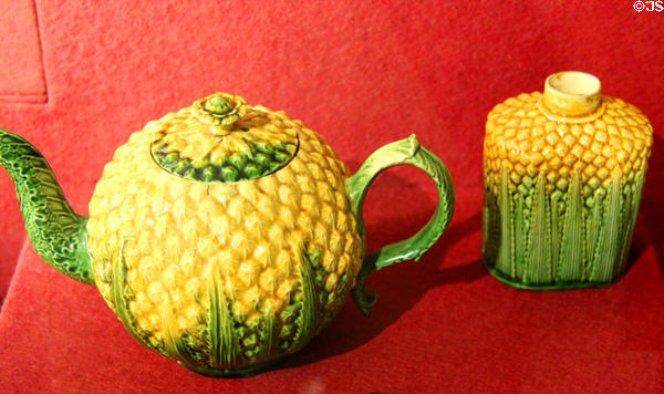 Collection of creamware tea vessels in shape of pineapples & cauliflowers with yellow & green glazes (c1760-70) attrib. Josiah & Thomas Wedgwood of Burslem, Staffordshire at Potteries Museum & Art Gallery. Hanley, Stoke-on-Trent, England.