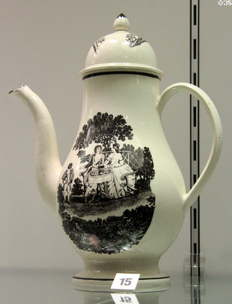 Creamware coffee pot printed with couple having tea in garden (c1880) prob. from Staffordshire at Potteries Museum & Art Gallery. Hanley, Stoke-on-Trent, England.