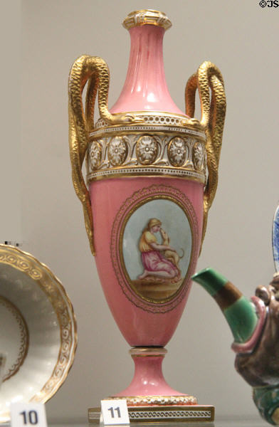 Bone china vase with raised decoration & gilt snake handles (1893-1900) by Brown-Westhead for Moore & Co. of Hanley, Staffordshire at Potteries Museum & Art Gallery. Hanley, Stoke-on-Trent, England.