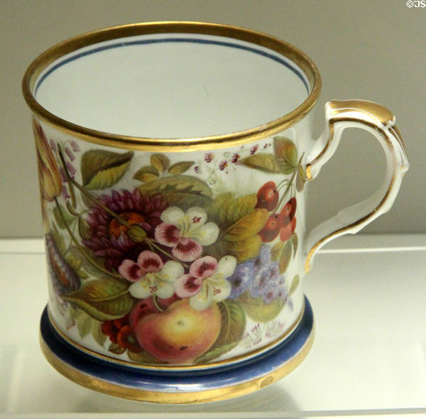 Example of over-glaze hand painting on bone china mug (mid 19thC) from Staffordshire at Potteries Museum & Art Gallery. Hanley, Stoke-on-Trent, England.