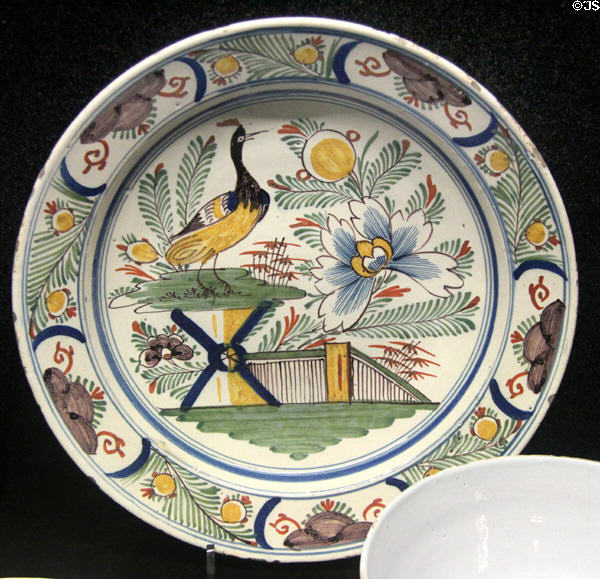 Tin-glazed earthenware dish painted in oriental style (1730-40). made in Bristol at Potteries Museum & Art Gallery. Hanley, Stoke-on-Trent, England.