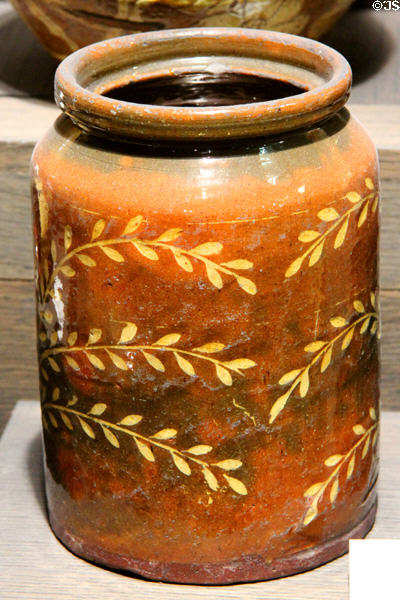 Earthenware storage jar with white slip (1811) made in Sussex at Potteries Museum & Art Gallery. Hanley, Stoke-on-Trent, England.