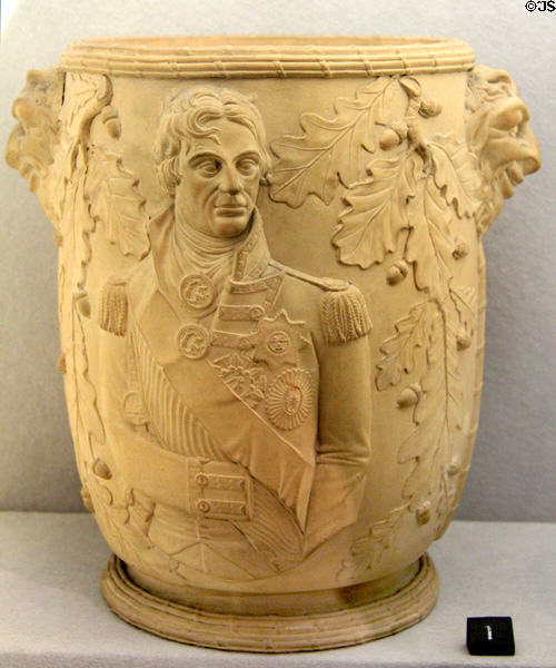 Terracotta wine cooler molded with portrait of Admiral Lord Nelson (1800-10) by Davenport at Potteries Museum & Art Gallery. Hanley, Stoke-on-Trent, England.