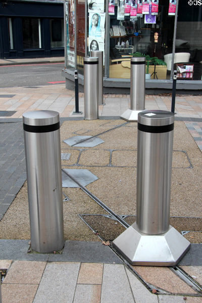 Traffic bollards which slide into place along tracks. Hanley, Stoke-on-Trent, England.