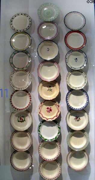 Queen's Ware plate collection showing many patterns sold (1770s-1800) by Wedgwood at World of Wedgwood. Barlaston, Stoke, England.